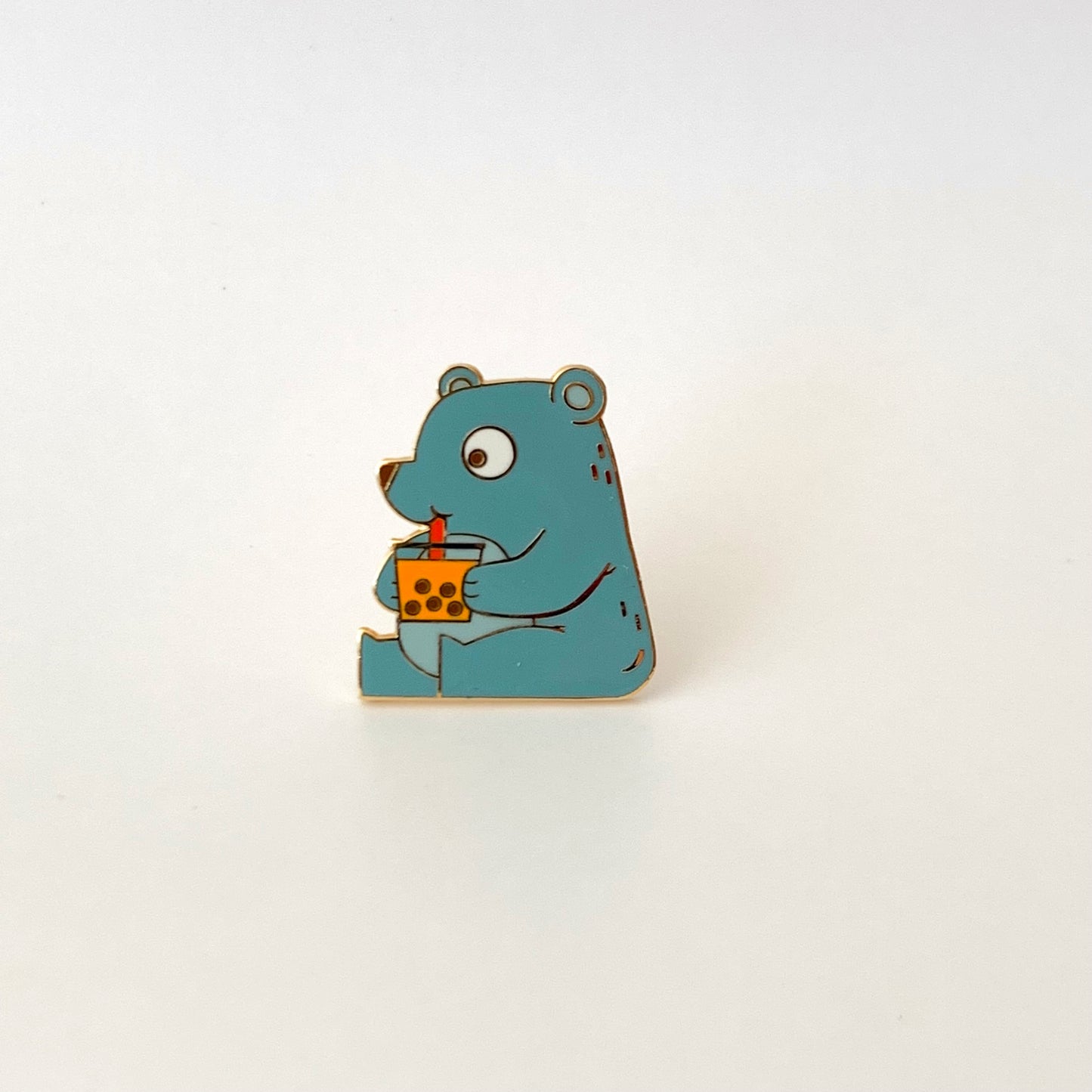 pin of a cute bear drinking boba