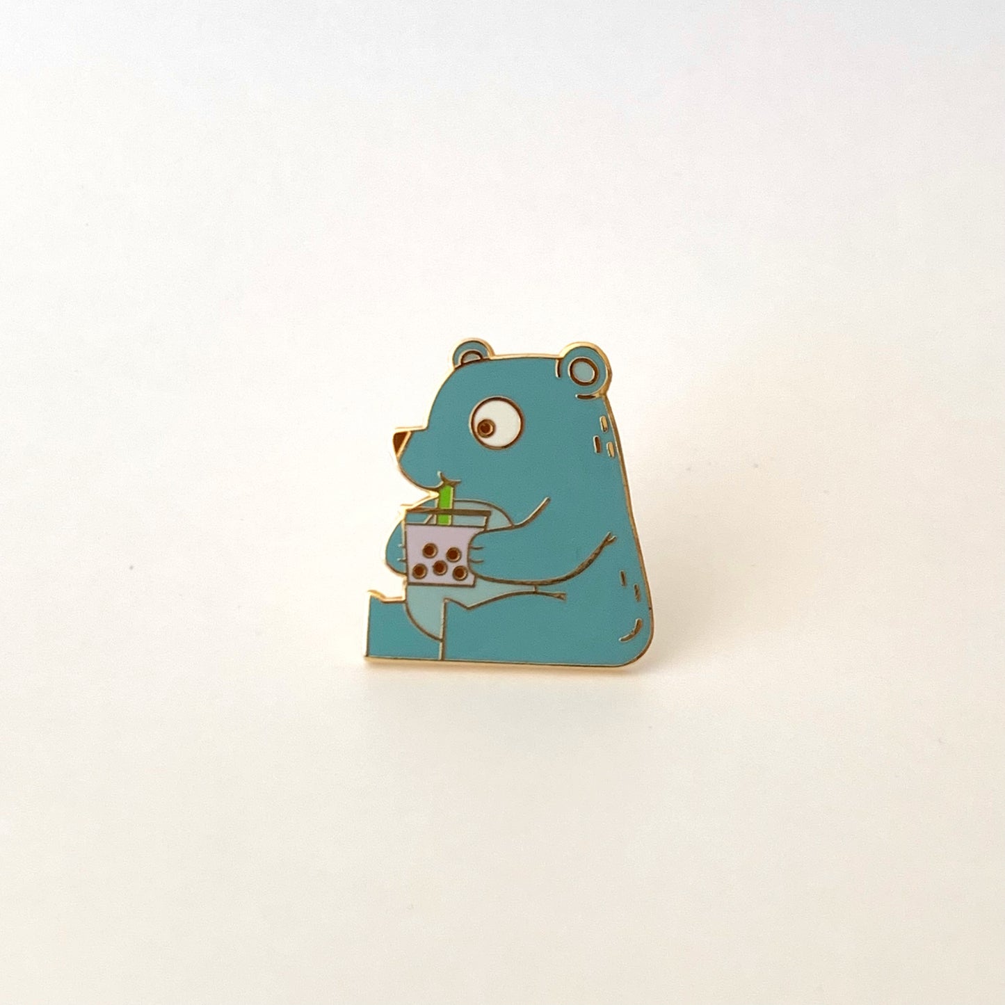 pin of a cute bear drinking boba