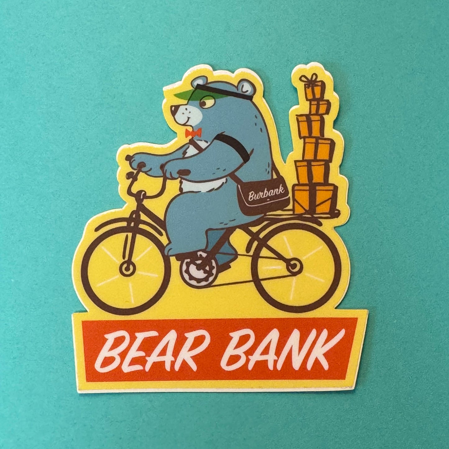 Bear Bank - Bear delivering Portos Pasteries with a Burbank messenger bag - STICKER