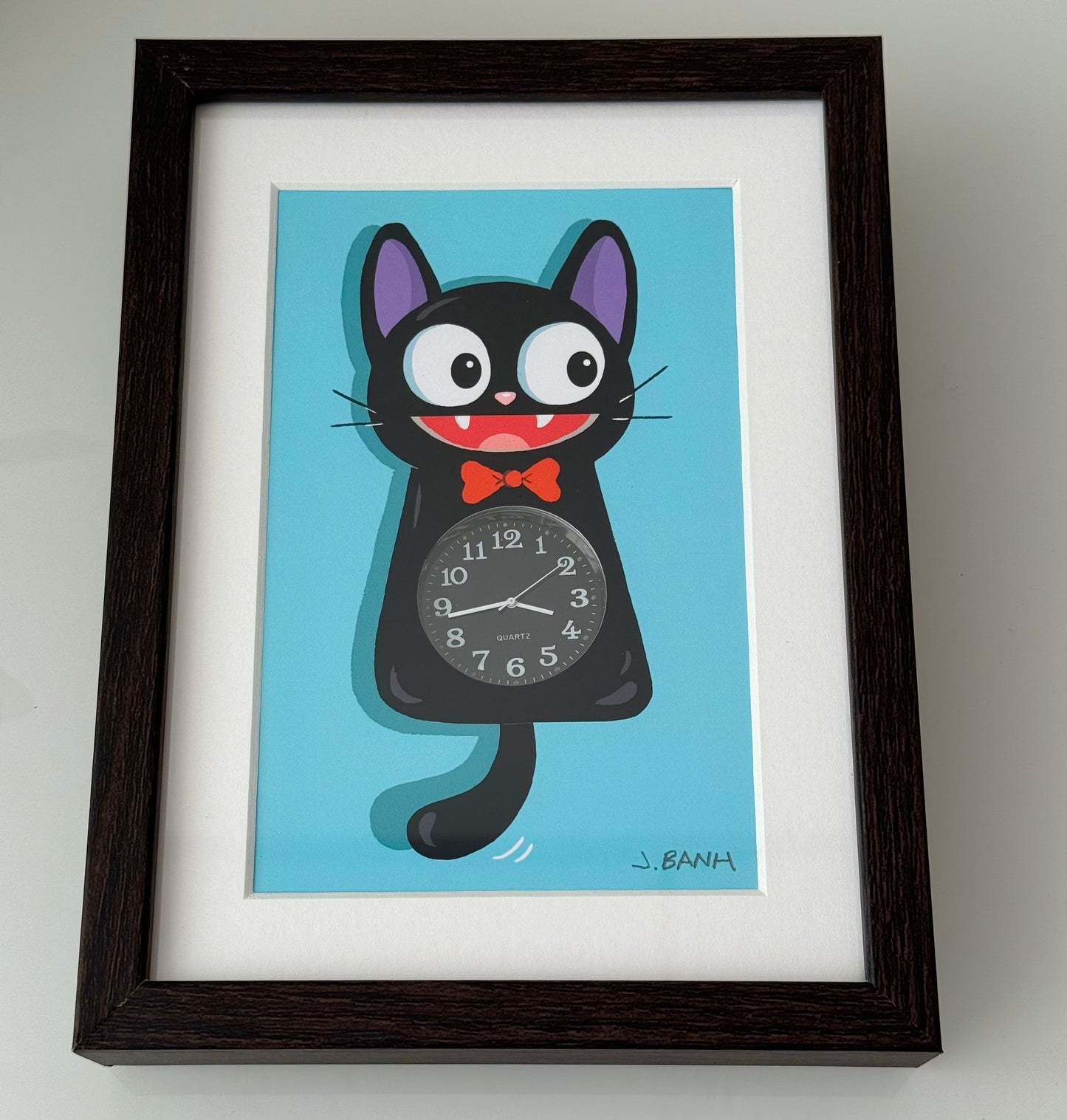 framed cat clock with working watch inside
