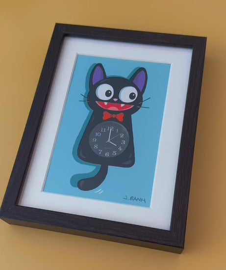 video of framed cat clock showing working watch inside