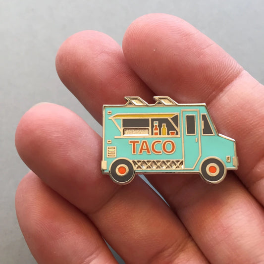 taco food truck enamel pin - pastel vintage green - hot sauce on counter - front view