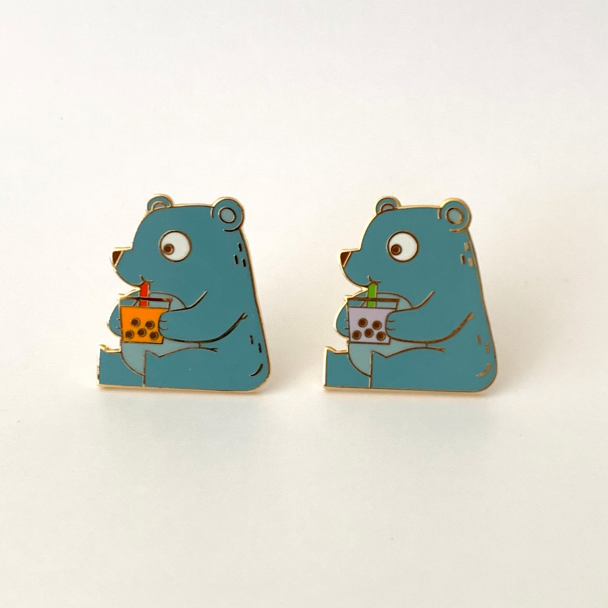 pin of a cute bear drinking boba 