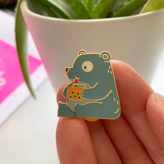 pin of a cute bear drinking boba 