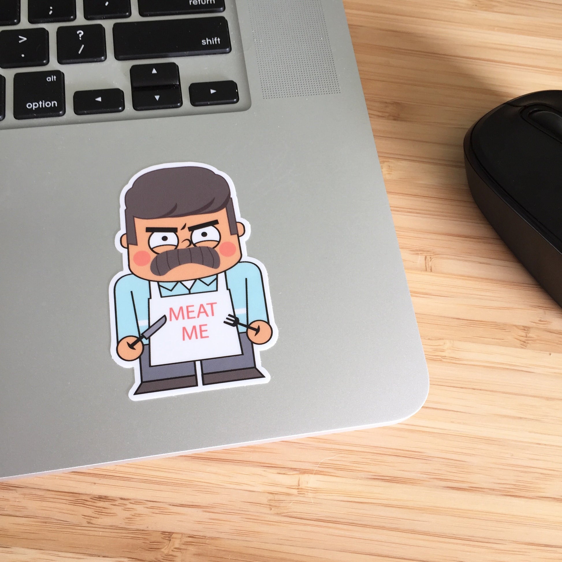 a sticker of mr swanson from parks and rec on a laptop